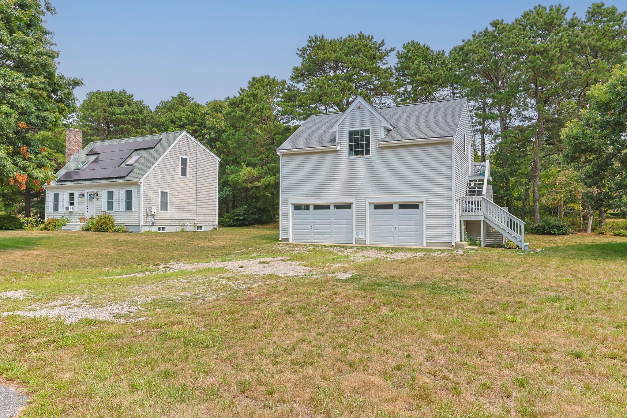 140 Noisy Hole Road Mashpee, MA 02649 - Photo 41 of 53 a view of a house with a yard and garage