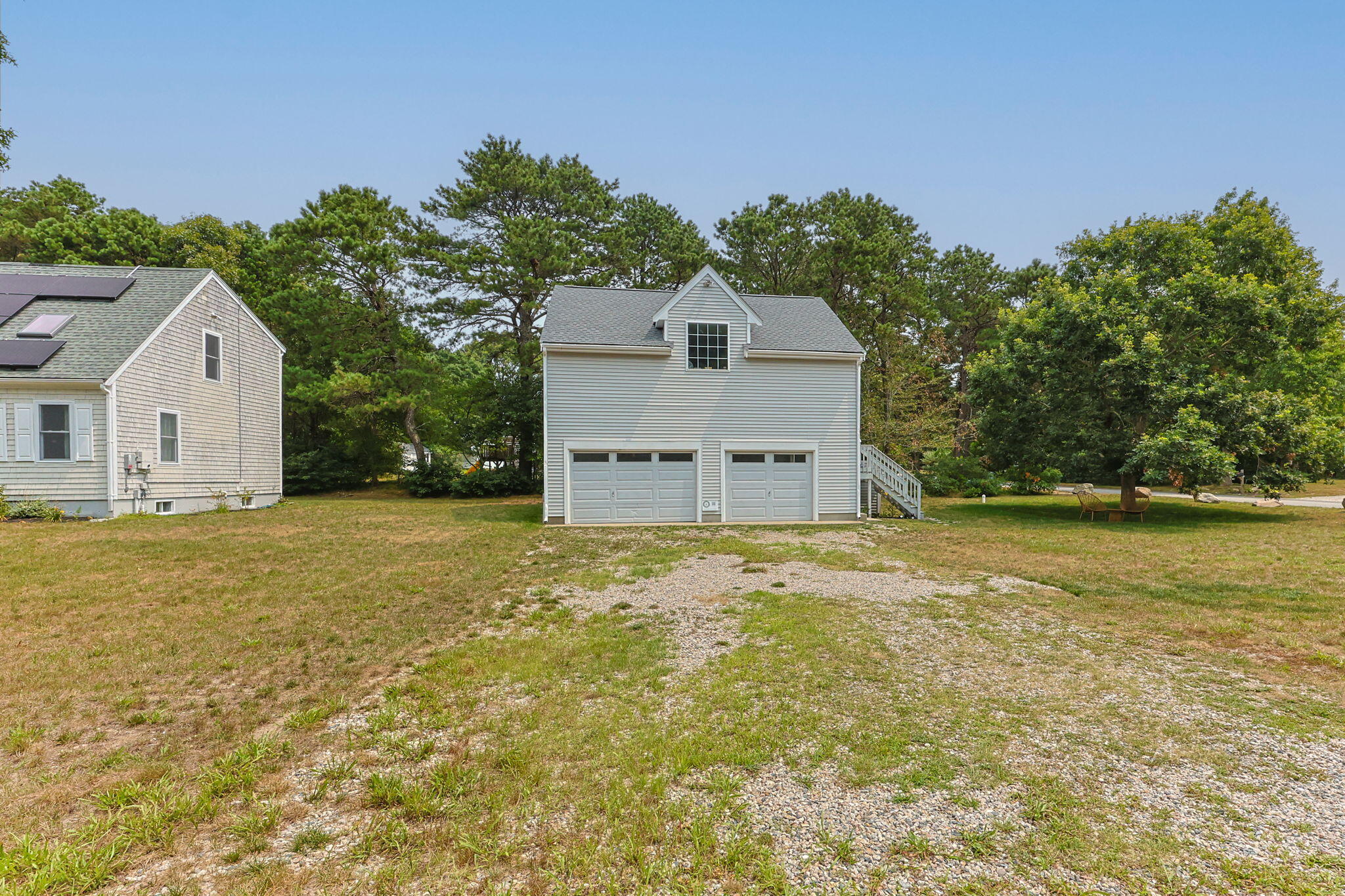 140 Noisy Hole Road Mashpee, MA 02649 - Photo 42 of 53 a house that has a tree in front of it