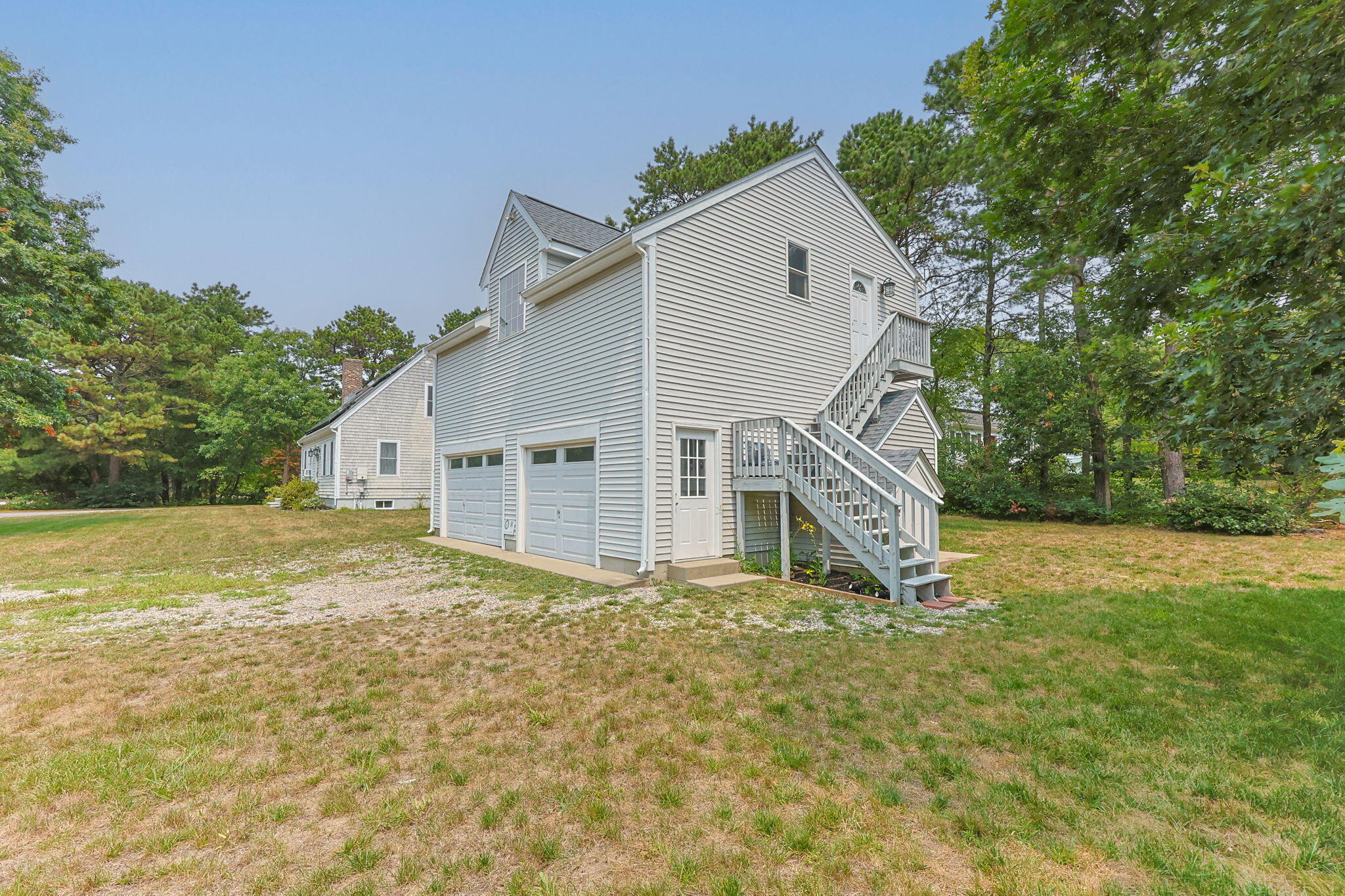 140 Noisy Hole Road Mashpee, MA 02649 - Photo 43 of 53 a view of a house with a yard