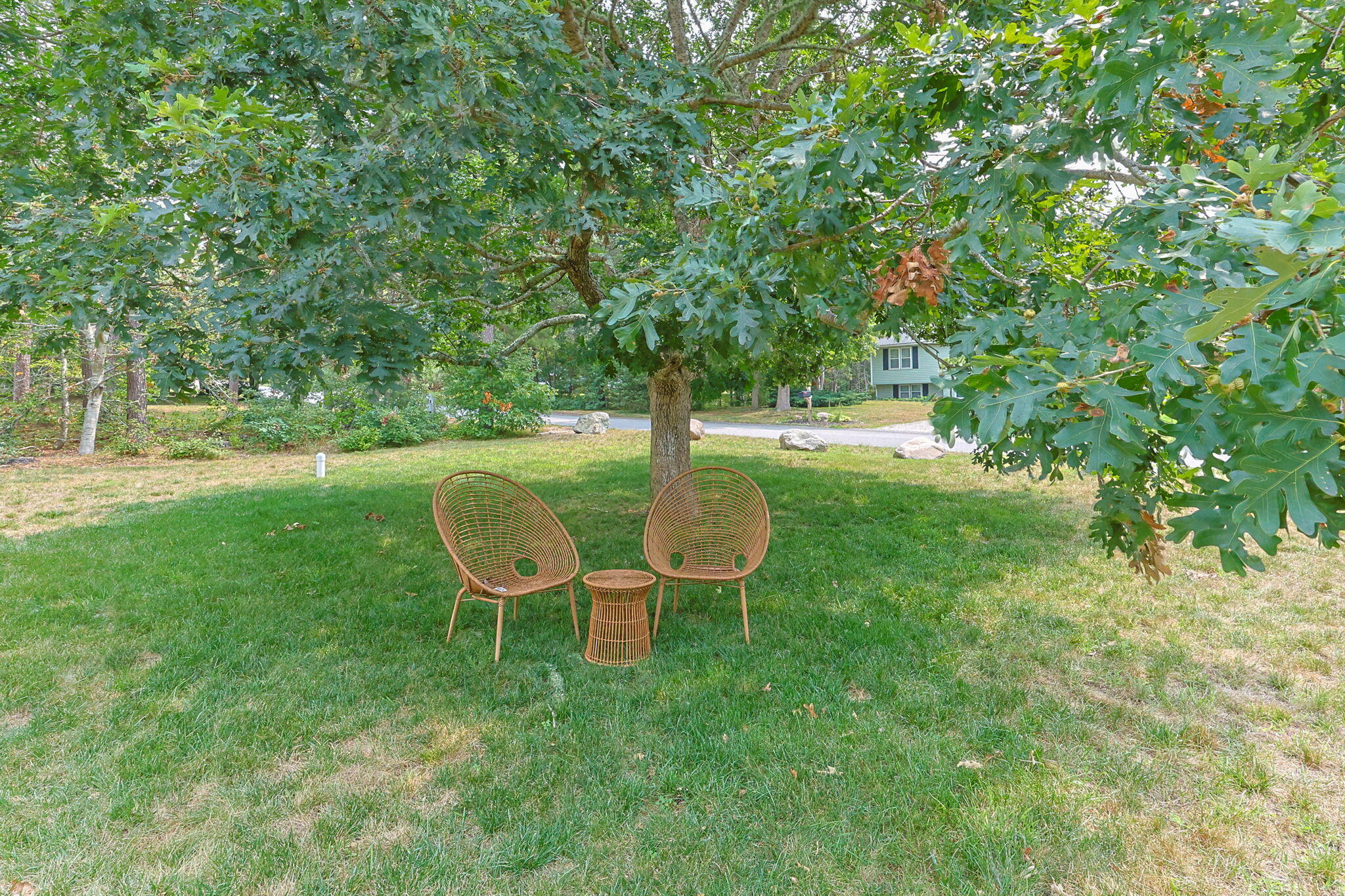140 Noisy Hole Road Mashpee, MA 02649 - Photo 45 of 53 a view of a chairs in backyard of the house