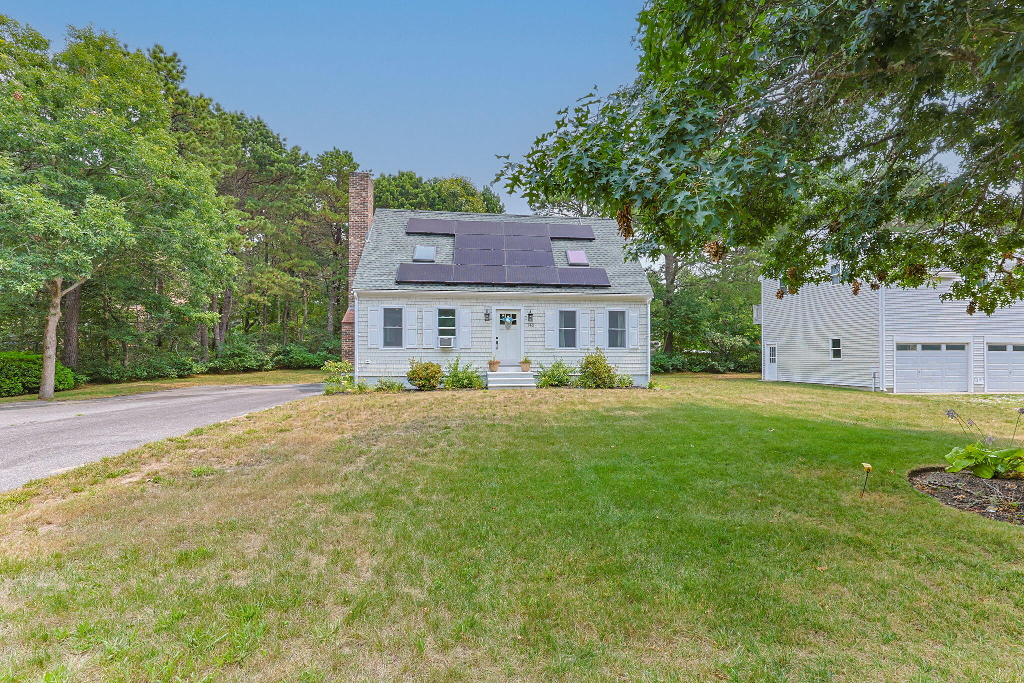 140 Noisy Hole Road Mashpee, MA 02649 - Photo 46 of 53 a view of a house with a yard