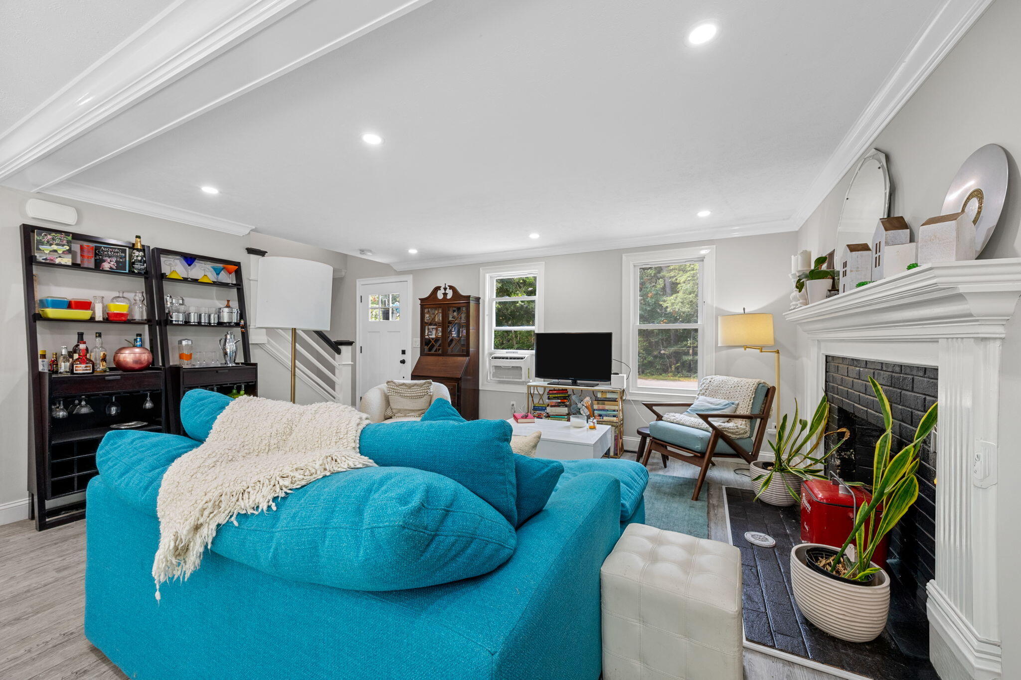 140 Noisy Hole Road Mashpee, MA 02649 - Photo 7 of 53 a living room with furniture fireplace and flat screen tv