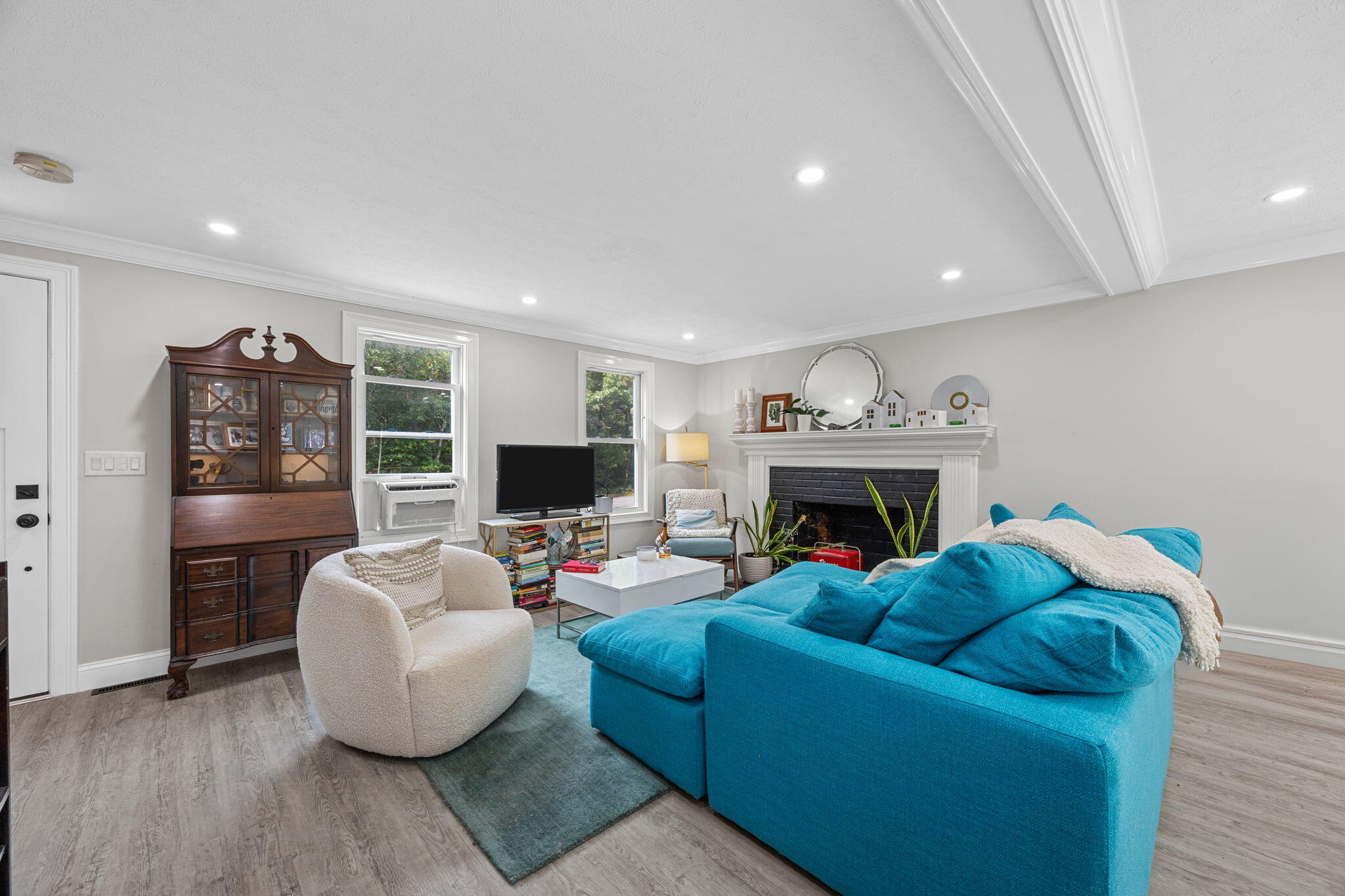 140 Noisy Hole Road Mashpee, MA 02649 - Photo 8 of 53 a living room with furniture and a fireplace