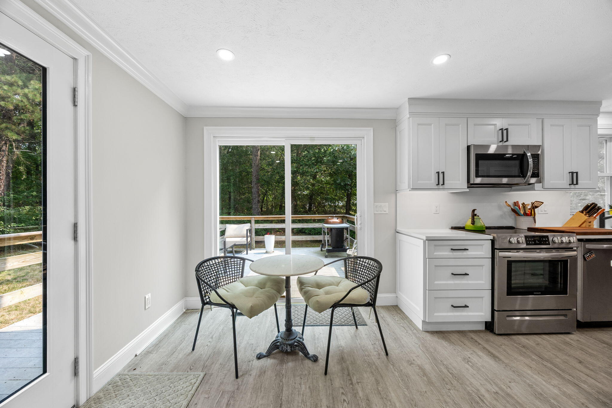 140 Noisy Hole Road Mashpee, MA 02649 - Photo 10 of 53 a view of a dining room with furniture window and outside view