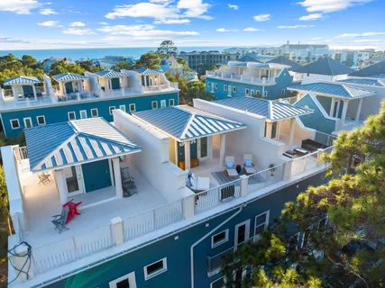 a balcony with chairs and city view