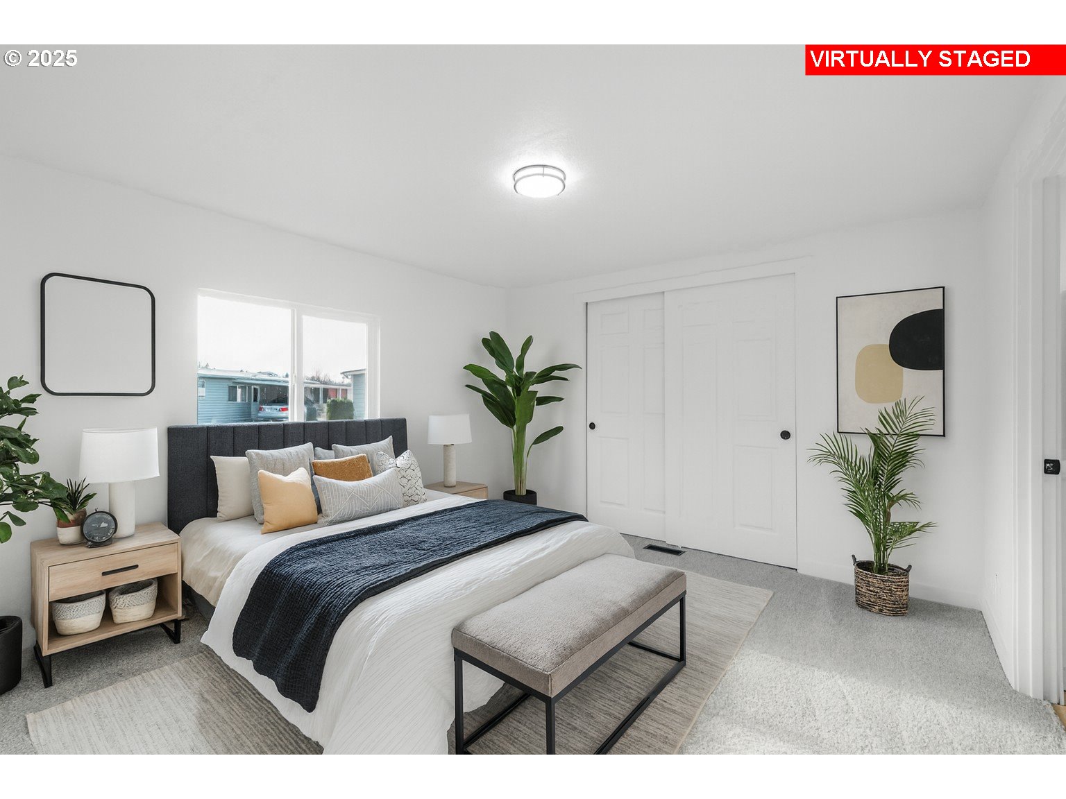 871 Liberty Bell Drive, Unit 474 Beaverton, OR 97006 - Photo 12 of 26 a bedroom with a bed and a potted plant