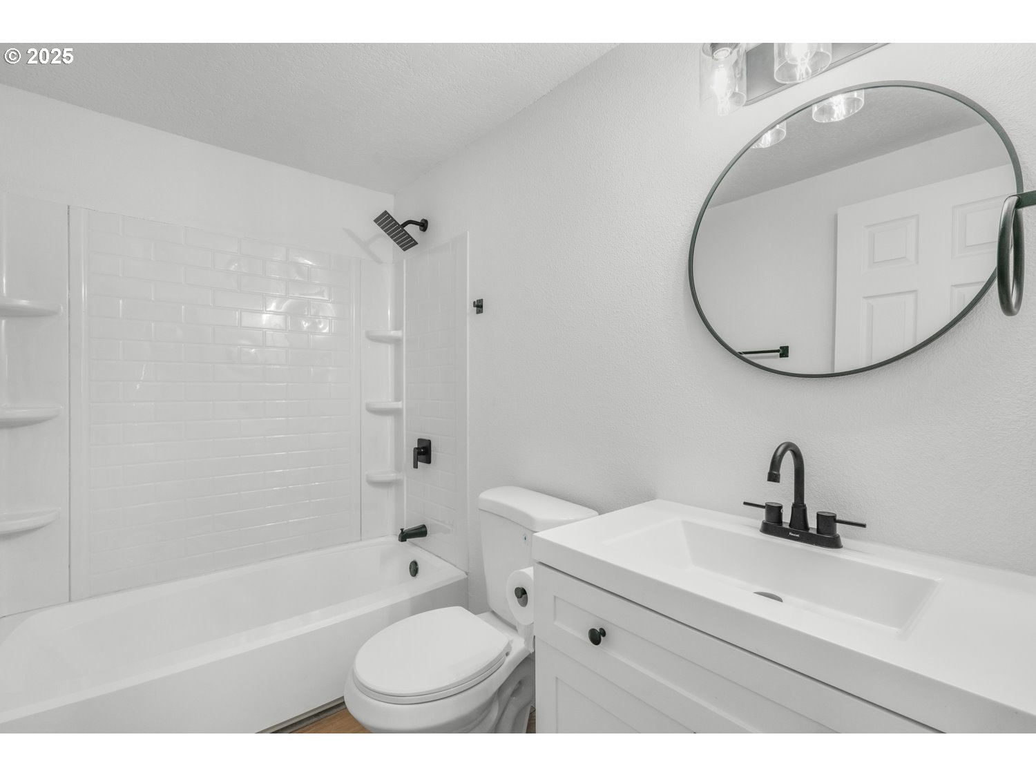 871 Liberty Bell Drive, Unit 474 Beaverton, OR 97006 - Photo 18 of 26 a bathroom with a sink a toilet and a mirror