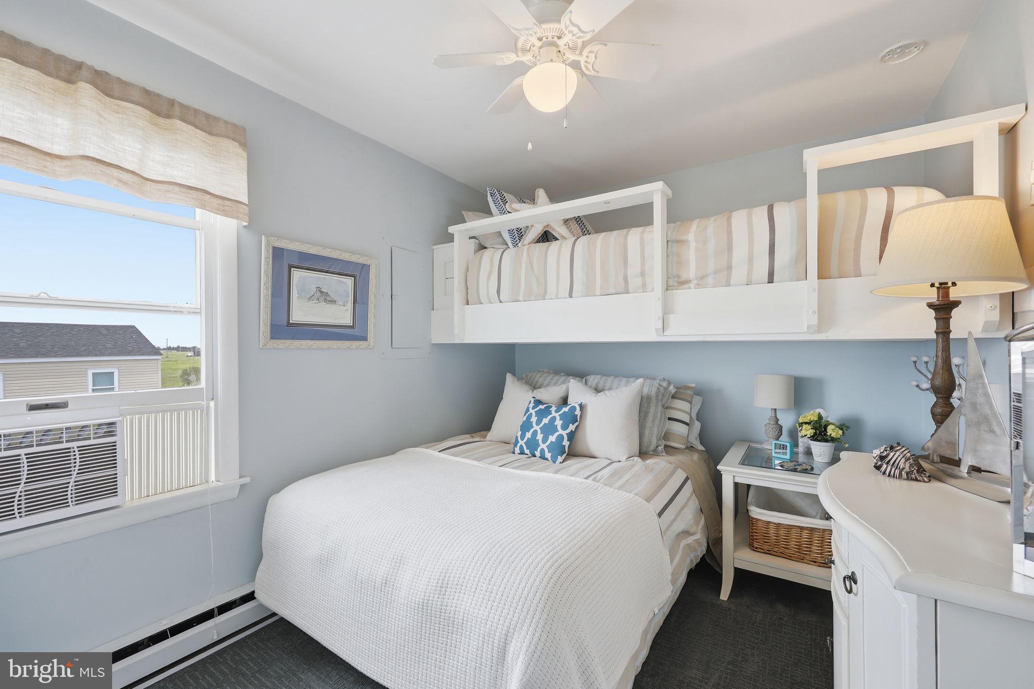 173 Cove Road Newport, NJ 08345 - Photo 29 of 72 a bedroom with a large bed and a chandelier