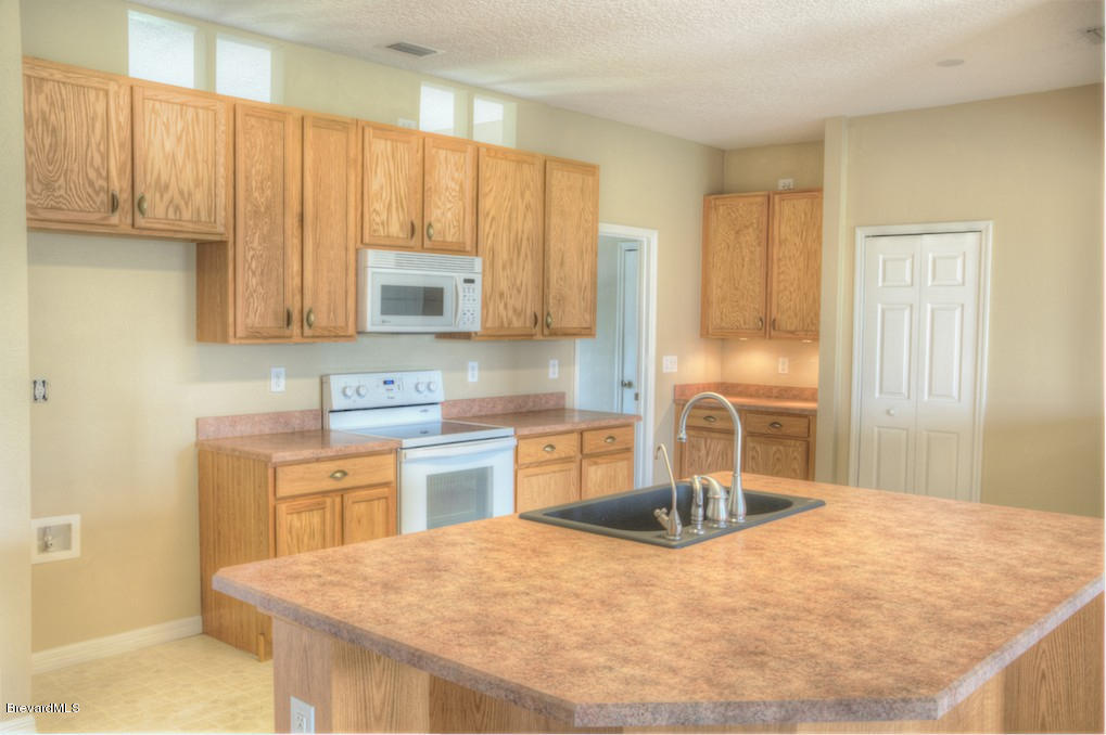 2110 Gandy Road Southwest Palm Bay, FL 32908 - Photo 7 of 18 Kitchen Island