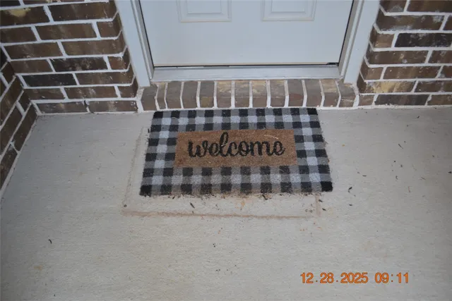 a view of wooden floor and a window