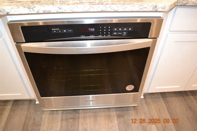 a bathroom with a shower and a mirror