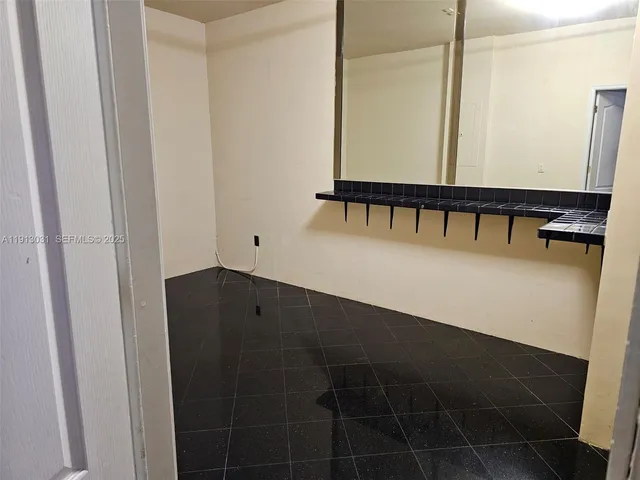 a view of an empty room with windows