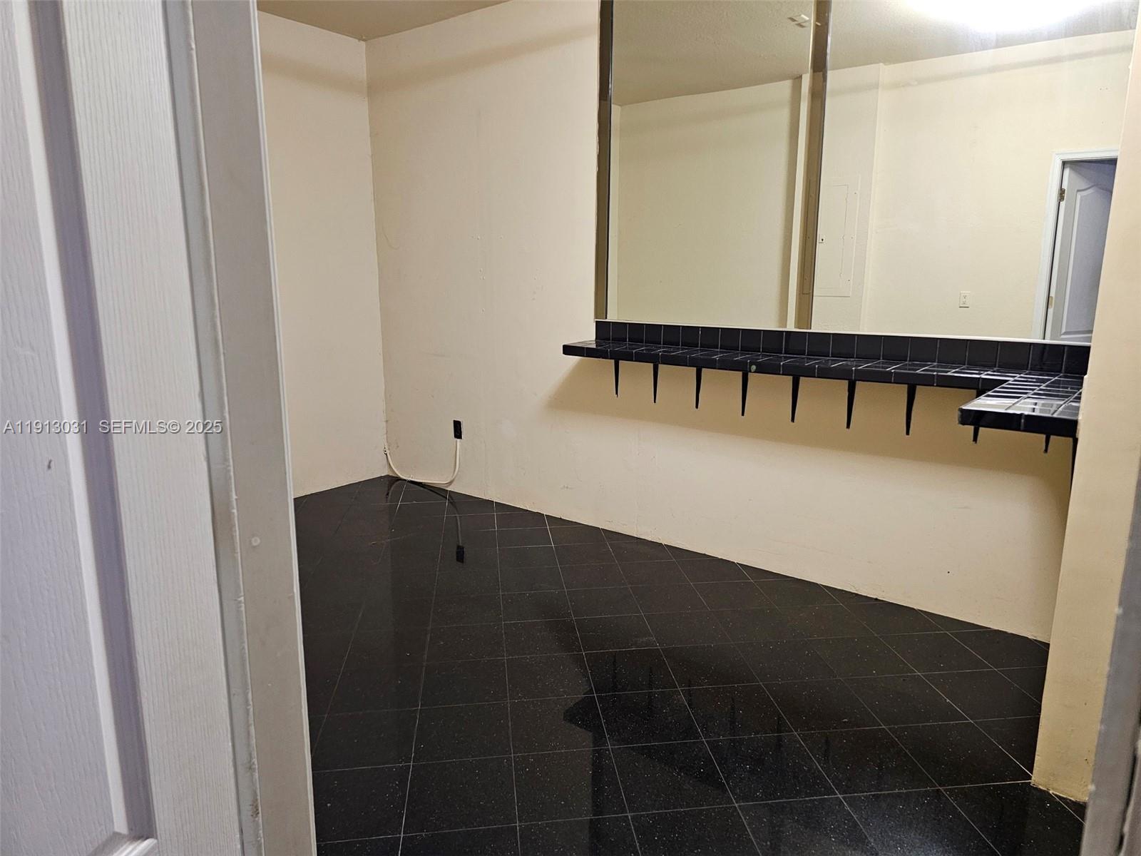 a view of an empty room with windows