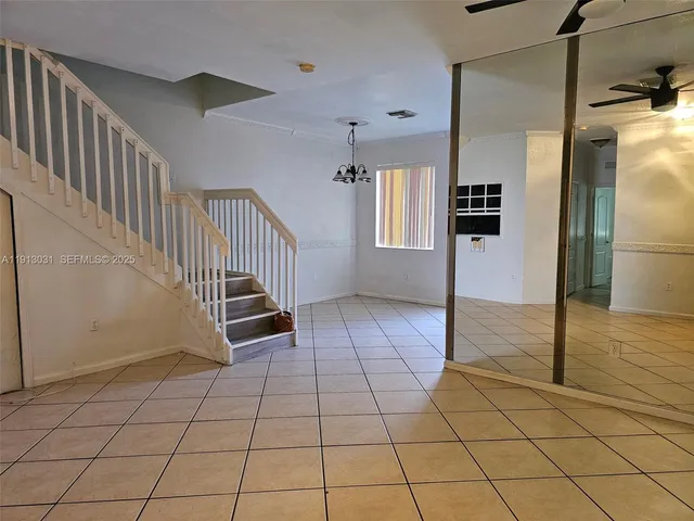 a view of kitchen with furniture and a window