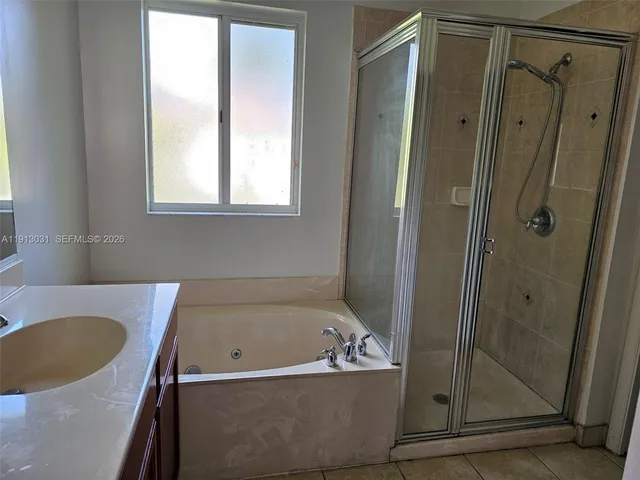 an empty room with wooden floor and closet