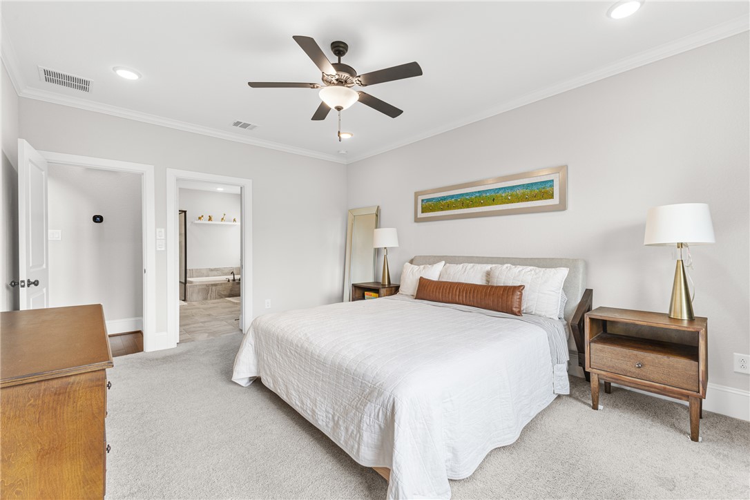 3632 Haskell Hollow Loop College Station, TX 77845 - Photo 17 of 42 a bedroom with a bed and a lamp