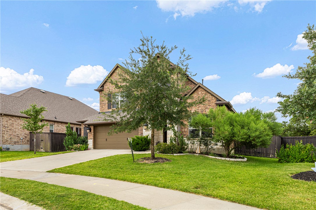 3632 Haskell Hollow Loop College Station, TX 77845 - Photo 2 of 42 a front view of a house with a yard