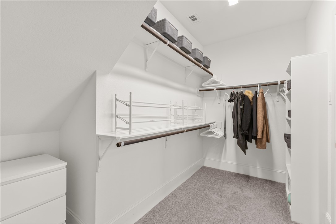 3632 Haskell Hollow Loop College Station, TX 77845 - Photo 21 of 42 a view of walk in closet with clothes and shoes