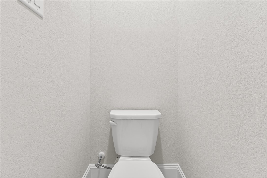 3632 Haskell Hollow Loop College Station, TX 77845 - Photo 22 of 42 a white toilet sitting next to a white wall