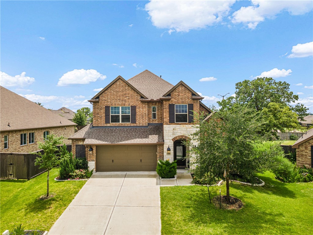 3632 Haskell Hollow Loop College Station, TX 77845 - Photo 40 of 42 a front view of a house with a yard