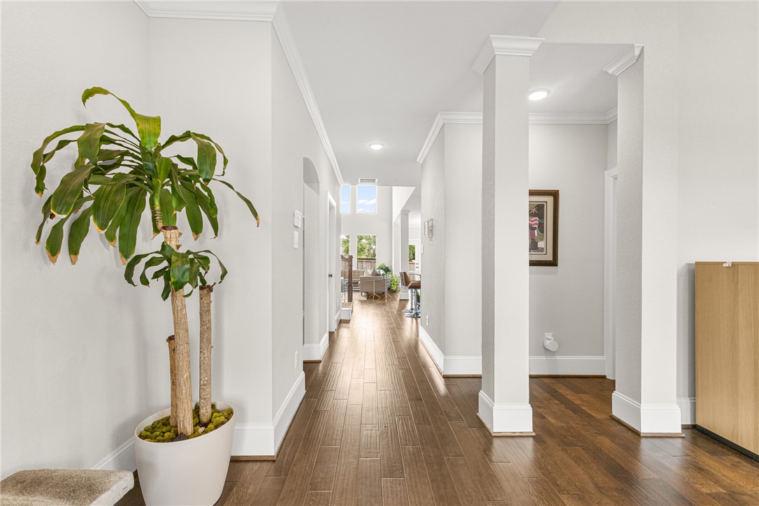 3632 Haskell Hollow Loop College Station, TX 77845 - Photo 4 of 42 a view of a hallway with wooden floor and a potted plant