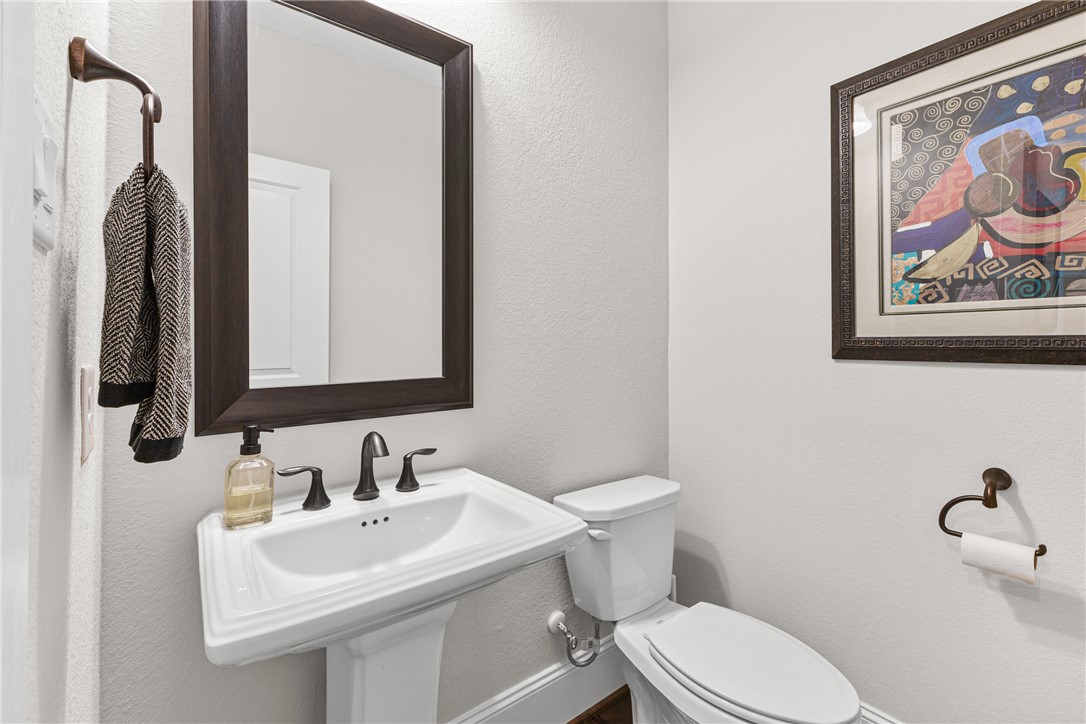 3632 Haskell Hollow Loop College Station, TX 77845 - Photo 7 of 42 a bathroom with a toilet sink and mirror