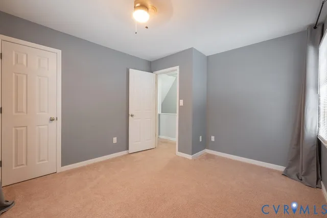 an empty room with closet area