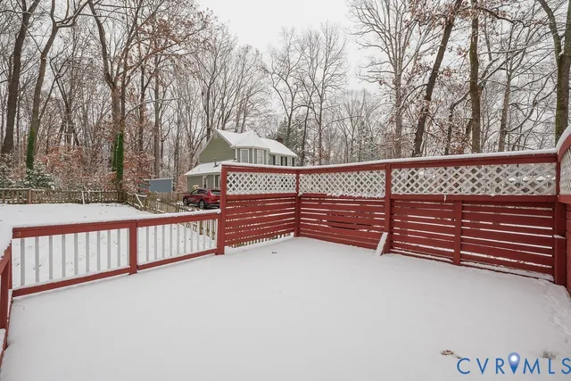a view of street with wooden fence