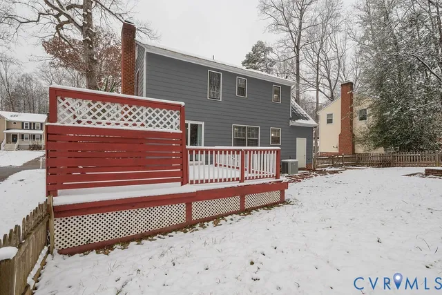 a view of a wooden house with a large trees