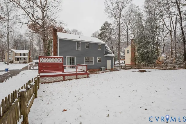 a view of a roof with wooden fence