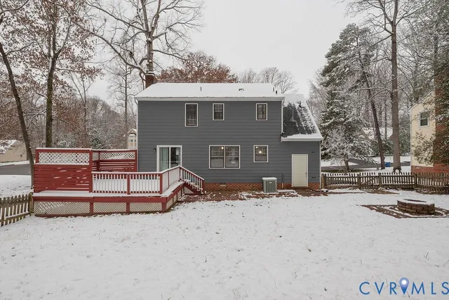 a view of a house with snow on the road