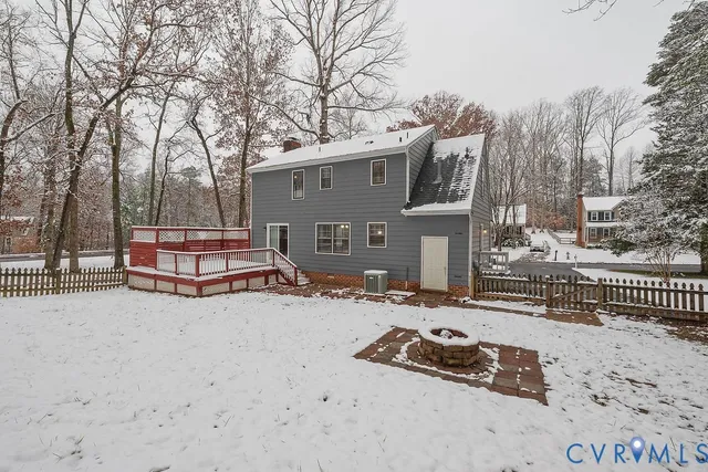 a backyard of a house with barbeque oven and trees