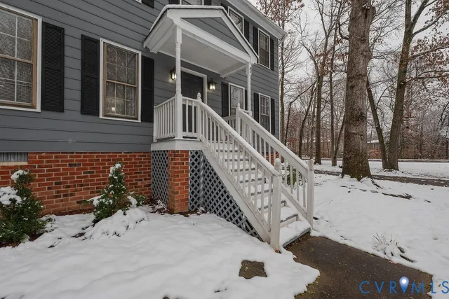 a view of a house with a snow on the road