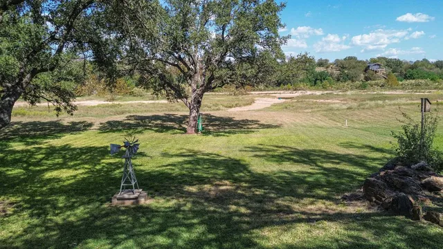 a view of a yard with an trees
