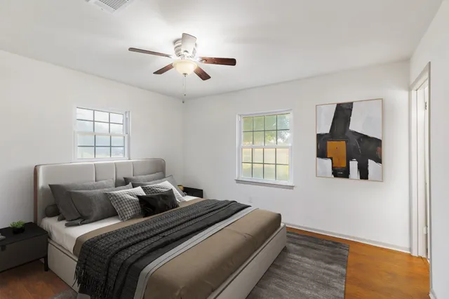 a bed room with bed and window