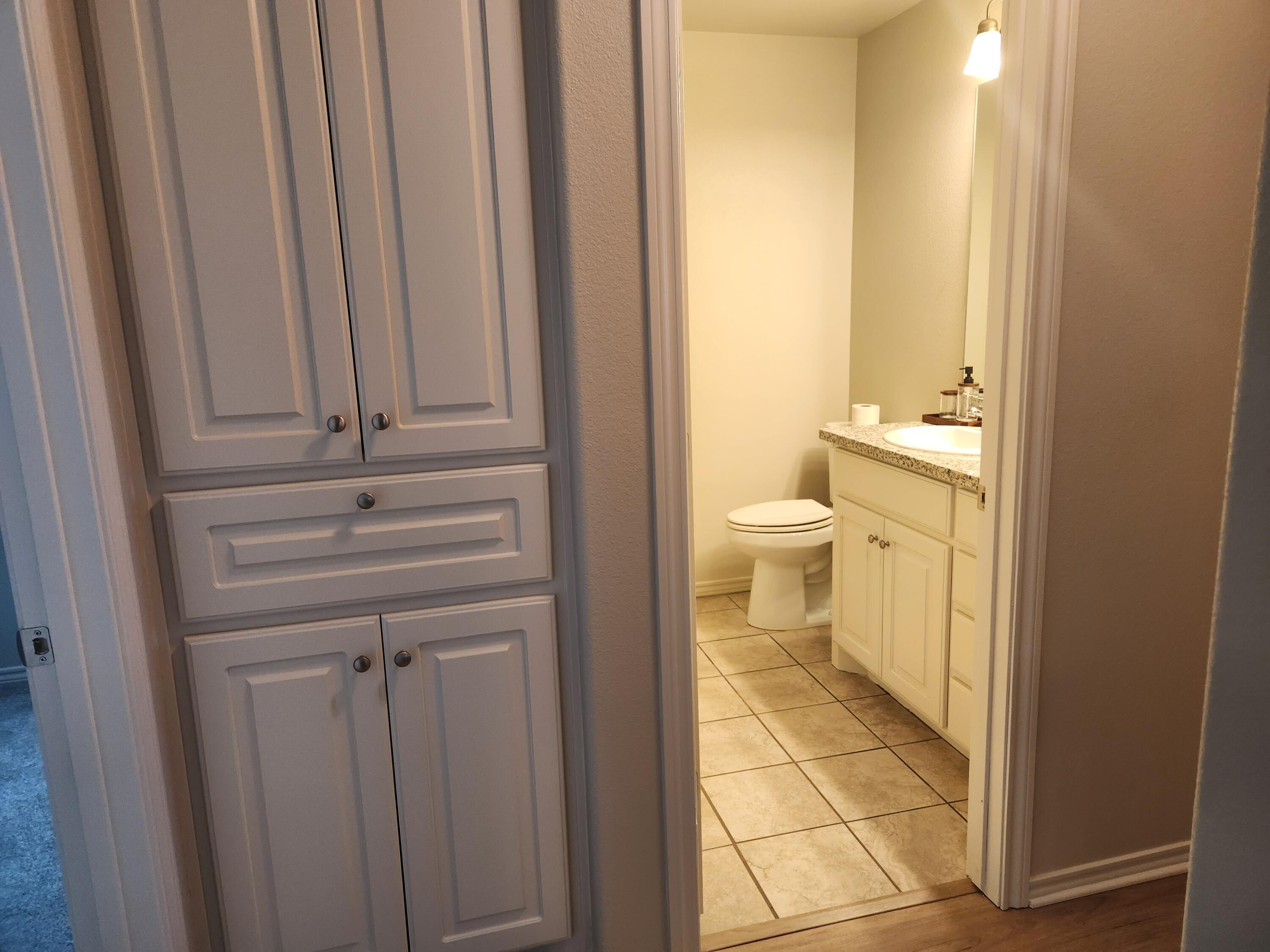 8702 13th Street Lubbock, TX 79416 - Photo 15 of 25 a bathroom with a toilet