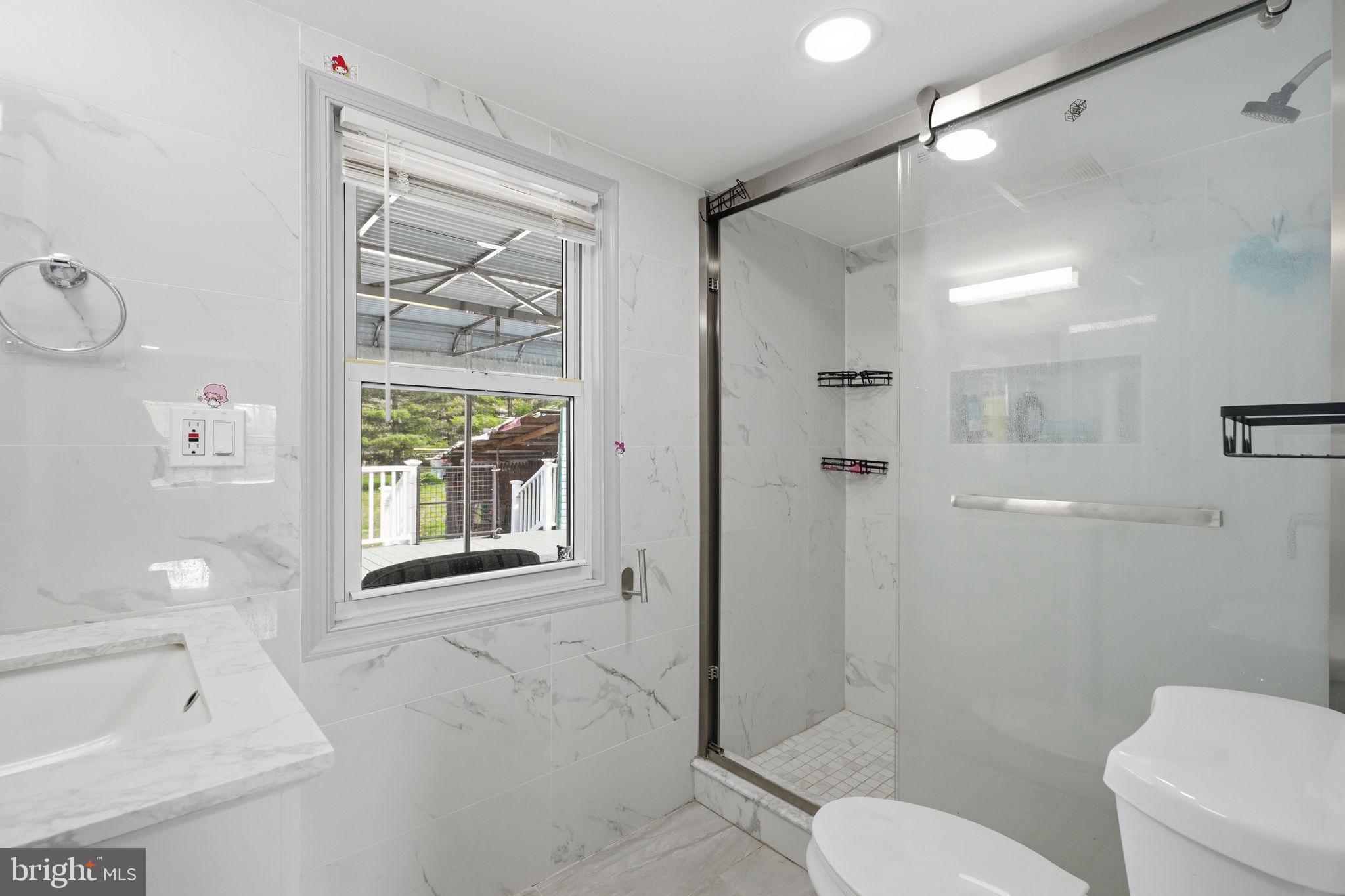 632 Durham Road Newtown, PA 18940 - Photo 12 of 37 a bathroom with a toilet sink and shower