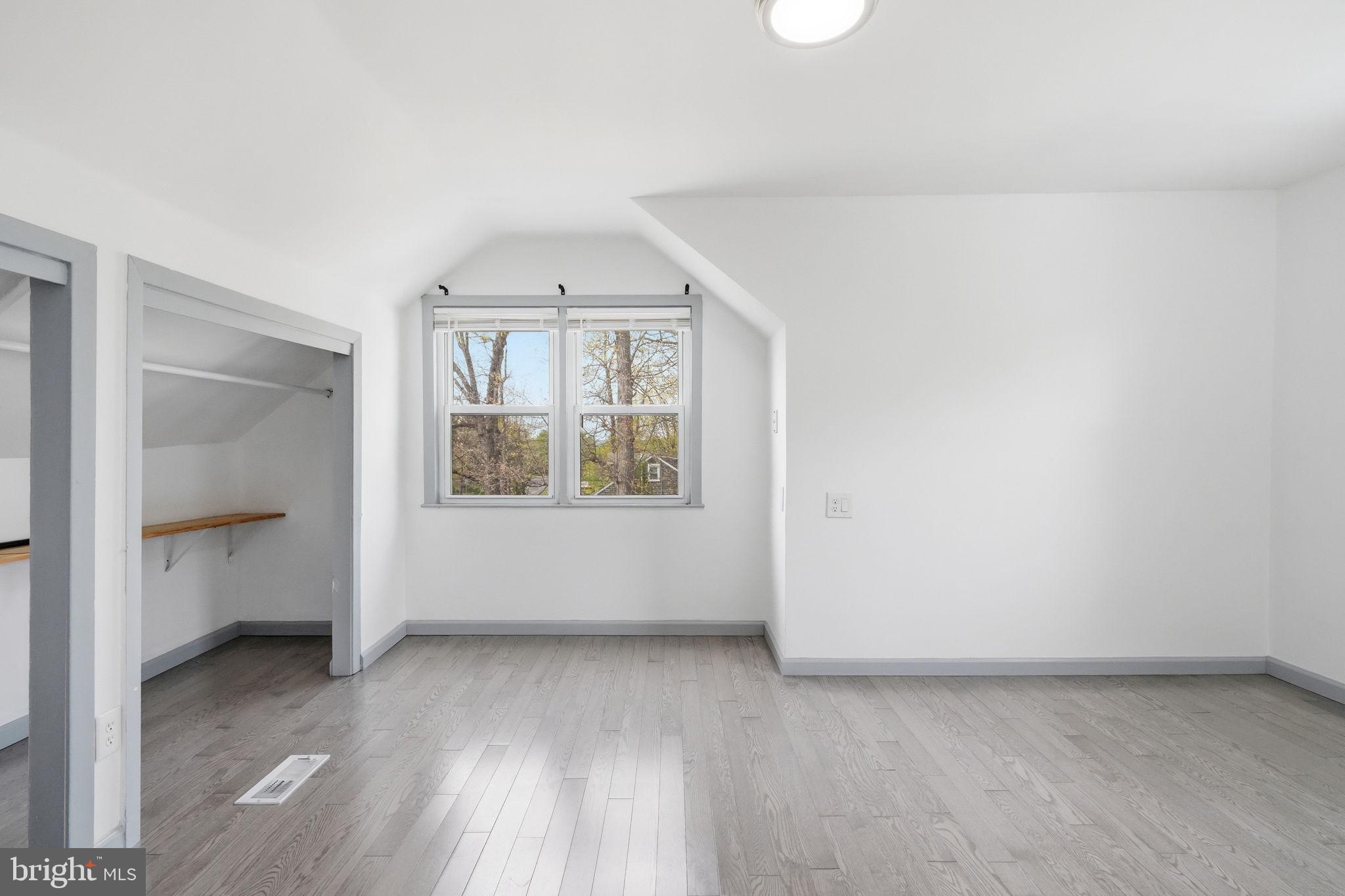 632 Durham Road Newtown, PA 18940 - Photo 17 of 37 an empty room with wooden floor and windows