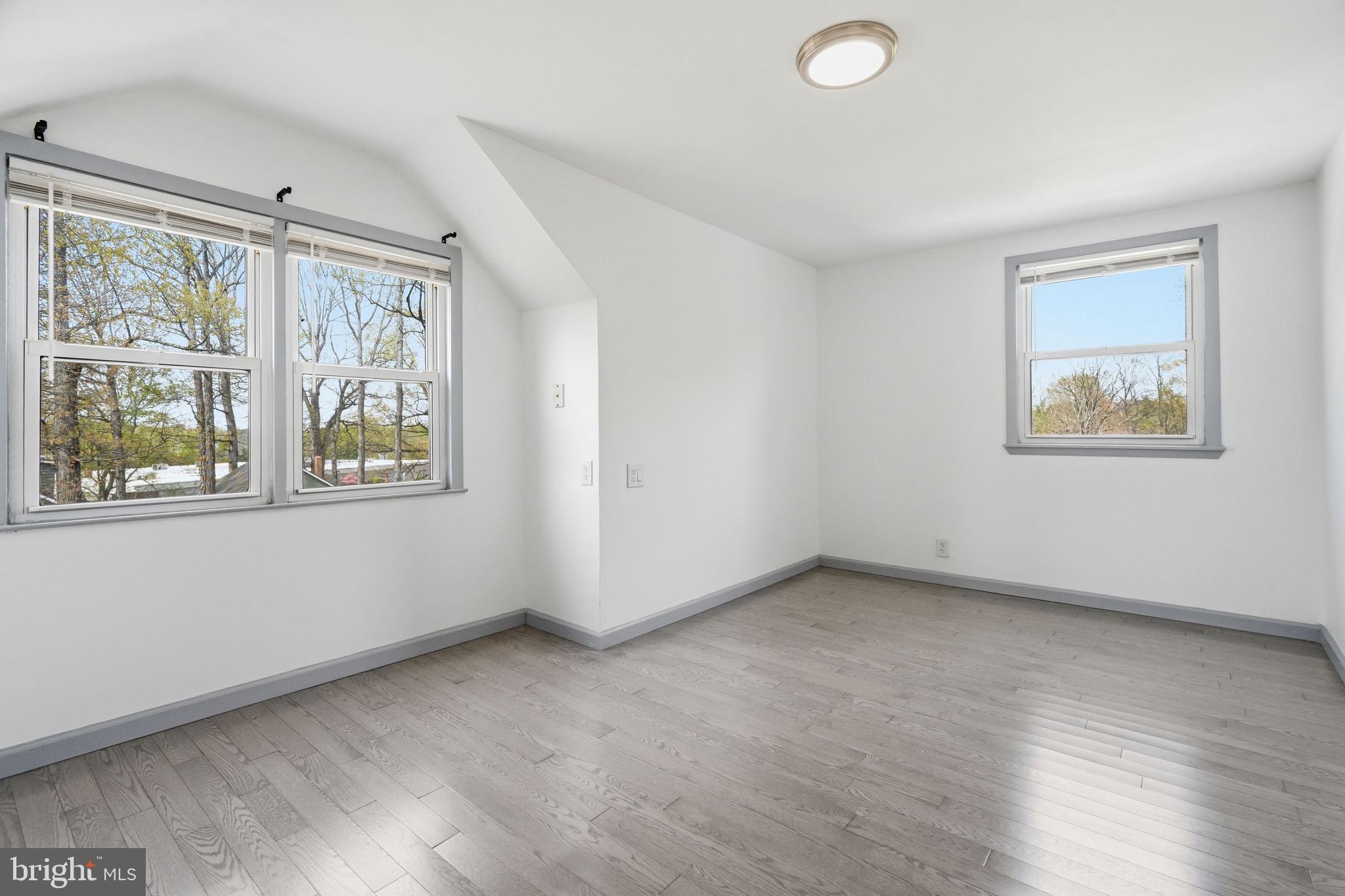 632 Durham Road Newtown, PA 18940 - Photo 18 of 37 a view of an empty room with a window and wooden floor