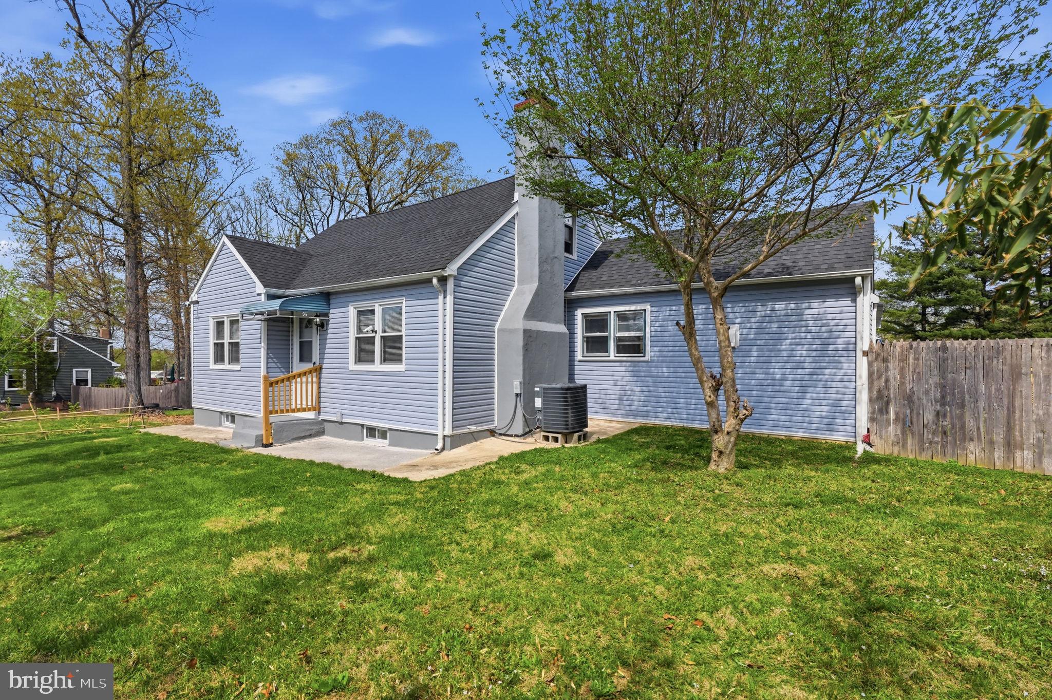 632 Durham Road Newtown, PA 18940 - Photo 2 of 37 a house that is sitting in the grass with tress in the background