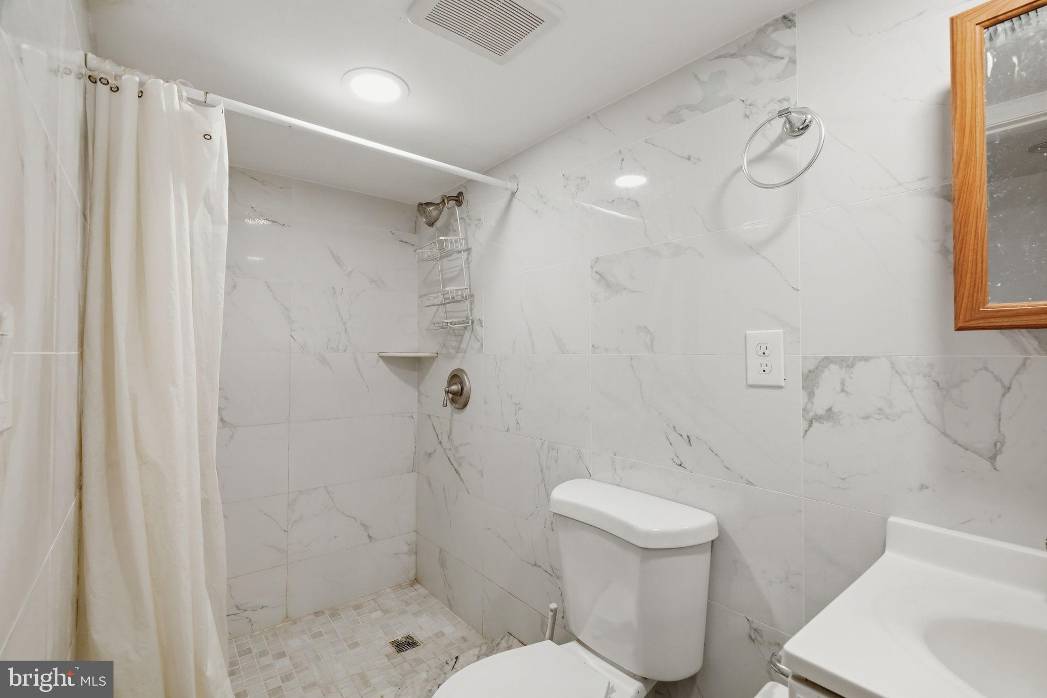 632 Durham Road Newtown, PA 18940 - Photo 29 of 37 a bathroom with a shower a toilet and sink