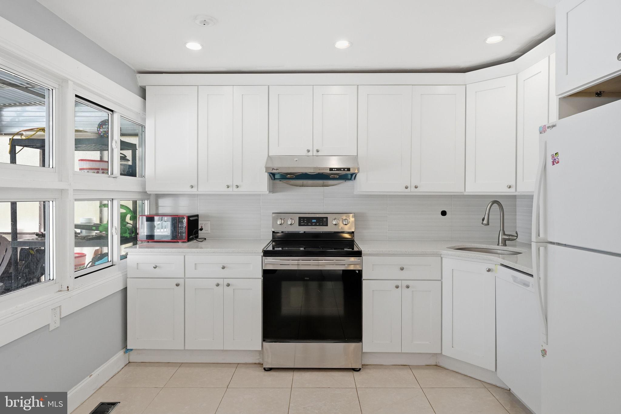632 Durham Road Newtown, PA 18940 - Photo 6 of 37 a kitchen with cabinets appliances and a sink