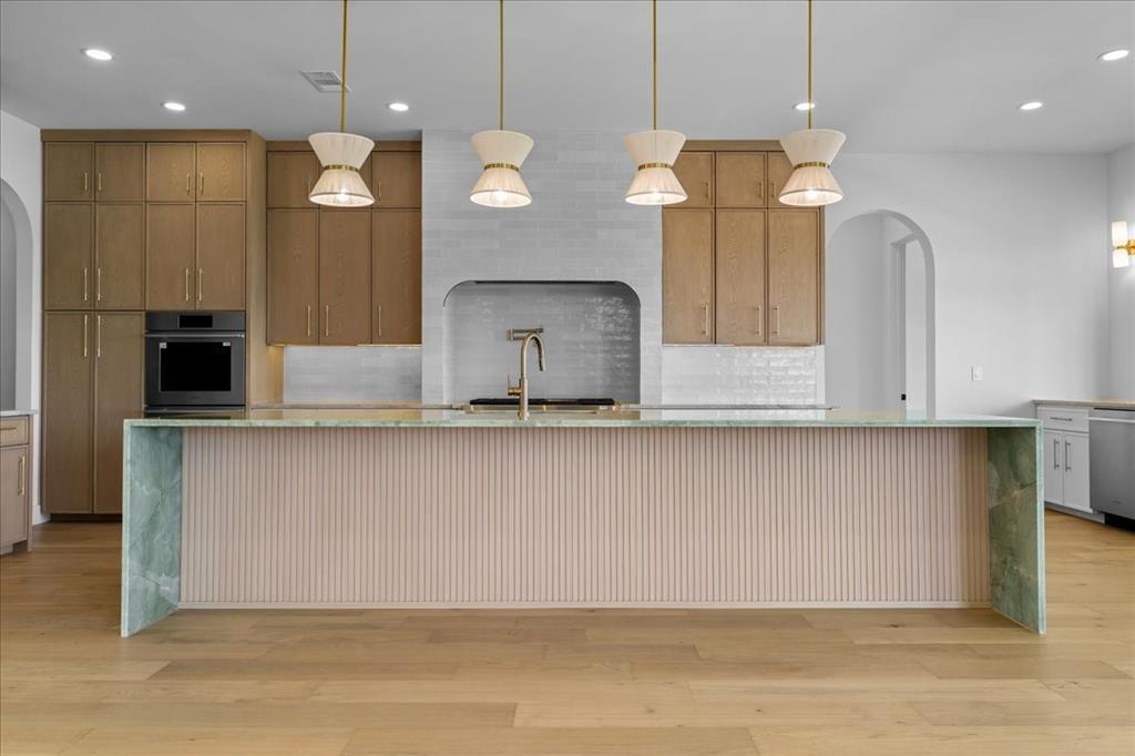 10576 Buccaneer Point Frisco, TX 75036 - Photo 10 of 40 a view of kitchen with cabinets and wooden floor