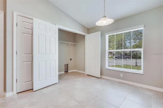 a view of empty room with windows