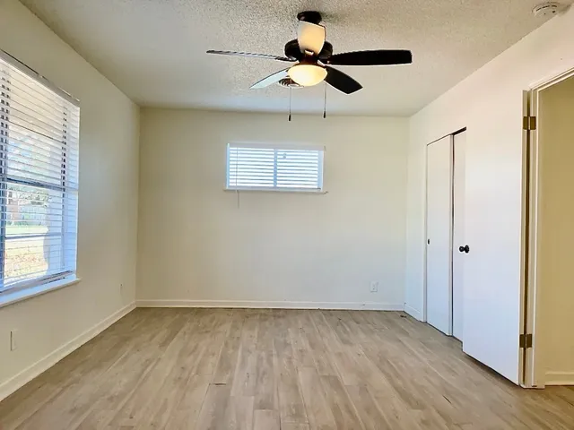 a bathroom with a toilet a sink and shower