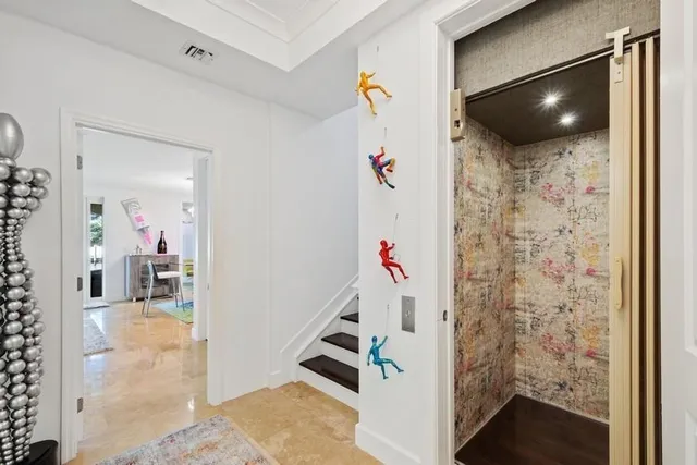 a bathroom with a bathtub sink vanity mirror and toilet