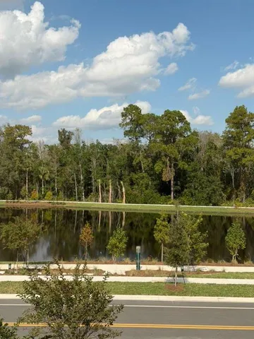 a kitchen with kitchen island granite countertop stainless steel appliances a refrigerator a stove a sink and a refrigerator