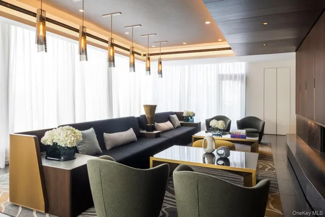 a swimming pool with outdoor seating and yard