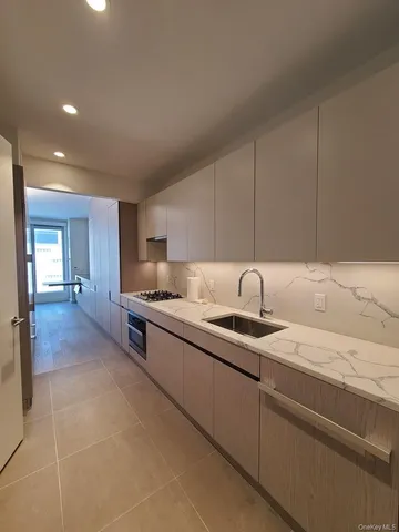 a kitchen with stainless steel appliances granite countertop a sink and cabinets