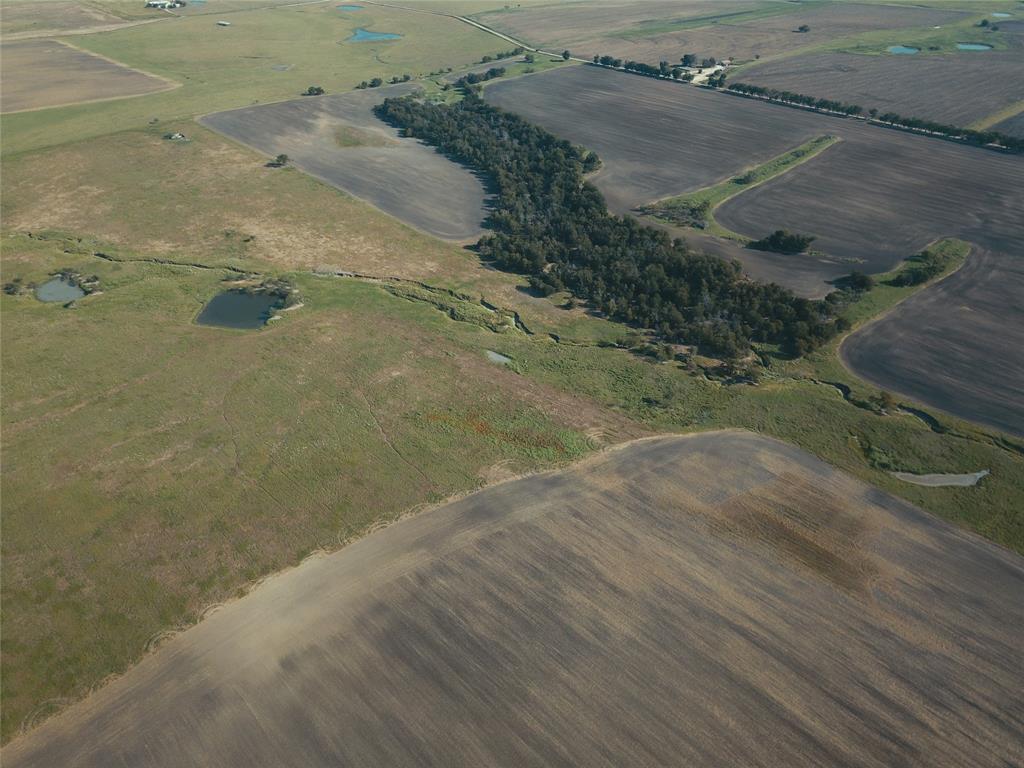 405 County Road 405 Lott, TX 76656 - Photo 5 of 9 a view of a dry yard with wooden fence